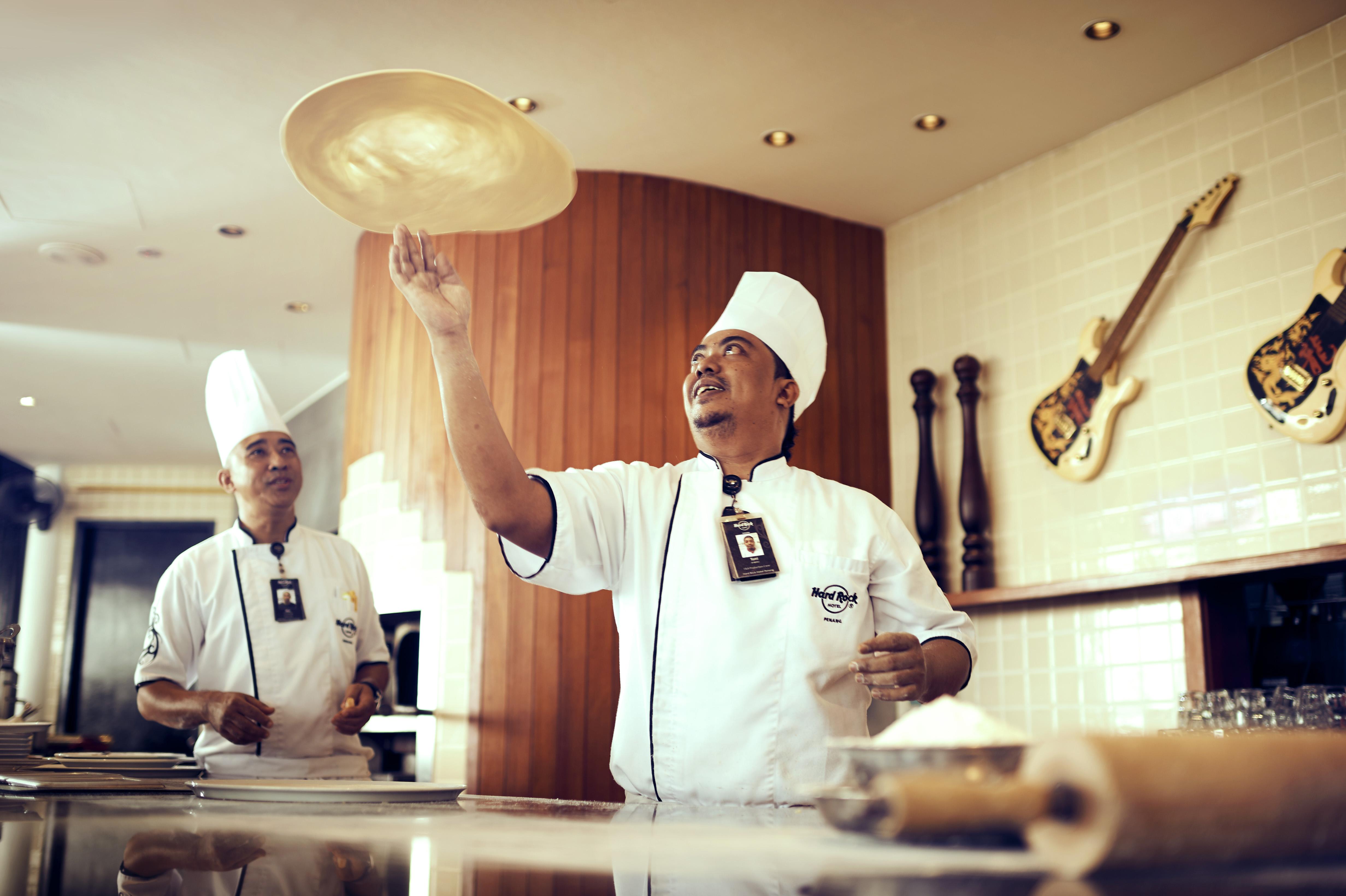 Hard Rock Hotel Penang Batu Feringgi Εξωτερικό φωτογραφία Pizzaiolo throwing pizza dough